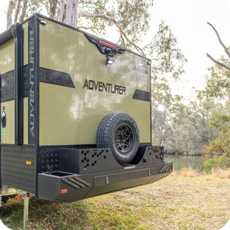 Heavy-duty rear bumper bar with large storage drawer, dual jerrycan holders, dual storage tubs, and spare wheel